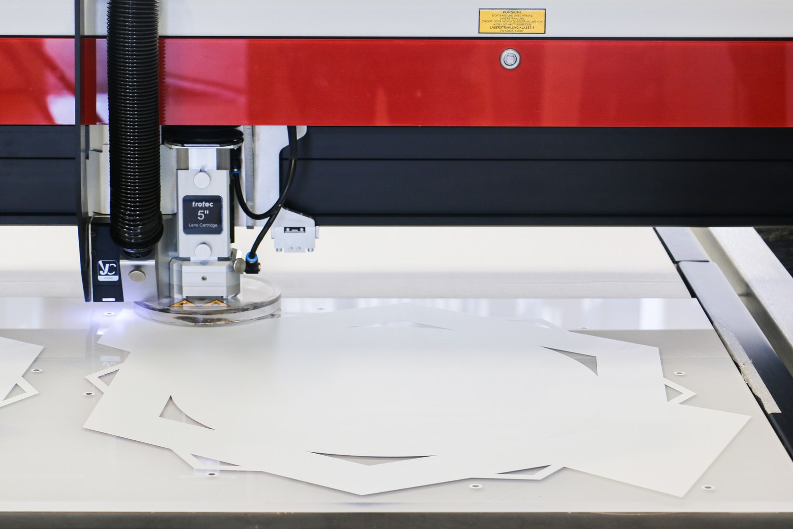 Detail of laser cutting of an acrylic sheet on a Trotec machine — manufacturer photo